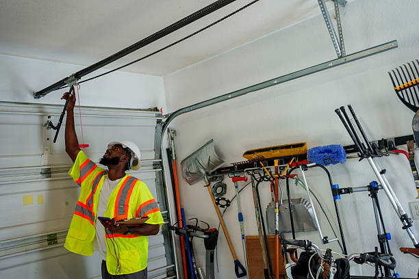 Professional Garage Door Panel Replacement technician working in Rowland, NC
